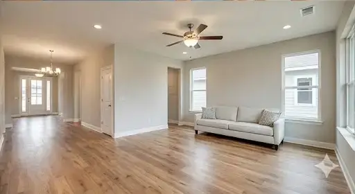 Modern living room with high-quality hardwood flooring and finishes, showcasing the final result of a residential remodel.